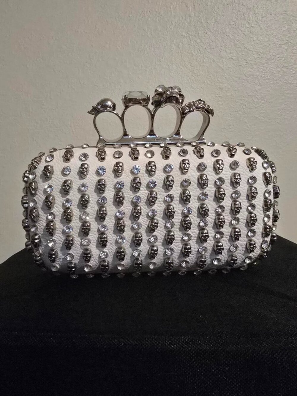 2000s White Skull and rhinestone clutch with four-ring knuckle clasp